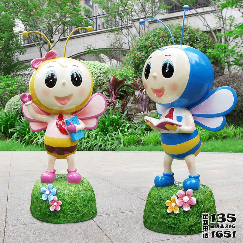 公園小區廣場擺拿書玻璃鋼卡通蜜蜂雕塑 公園小區廣場擺拿書玻璃鋼卡通蜜蜂雕塑